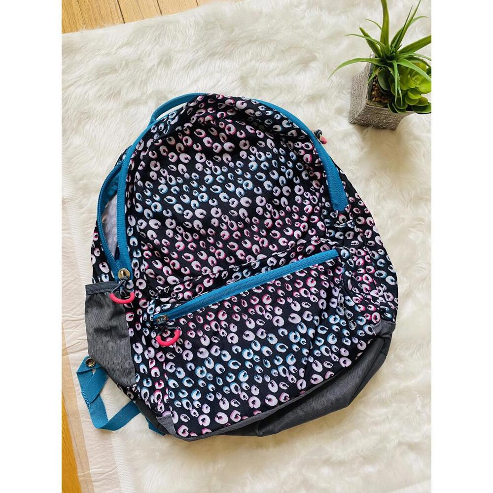Multi-Color Patterned Backpack With Blue Accents - image 1